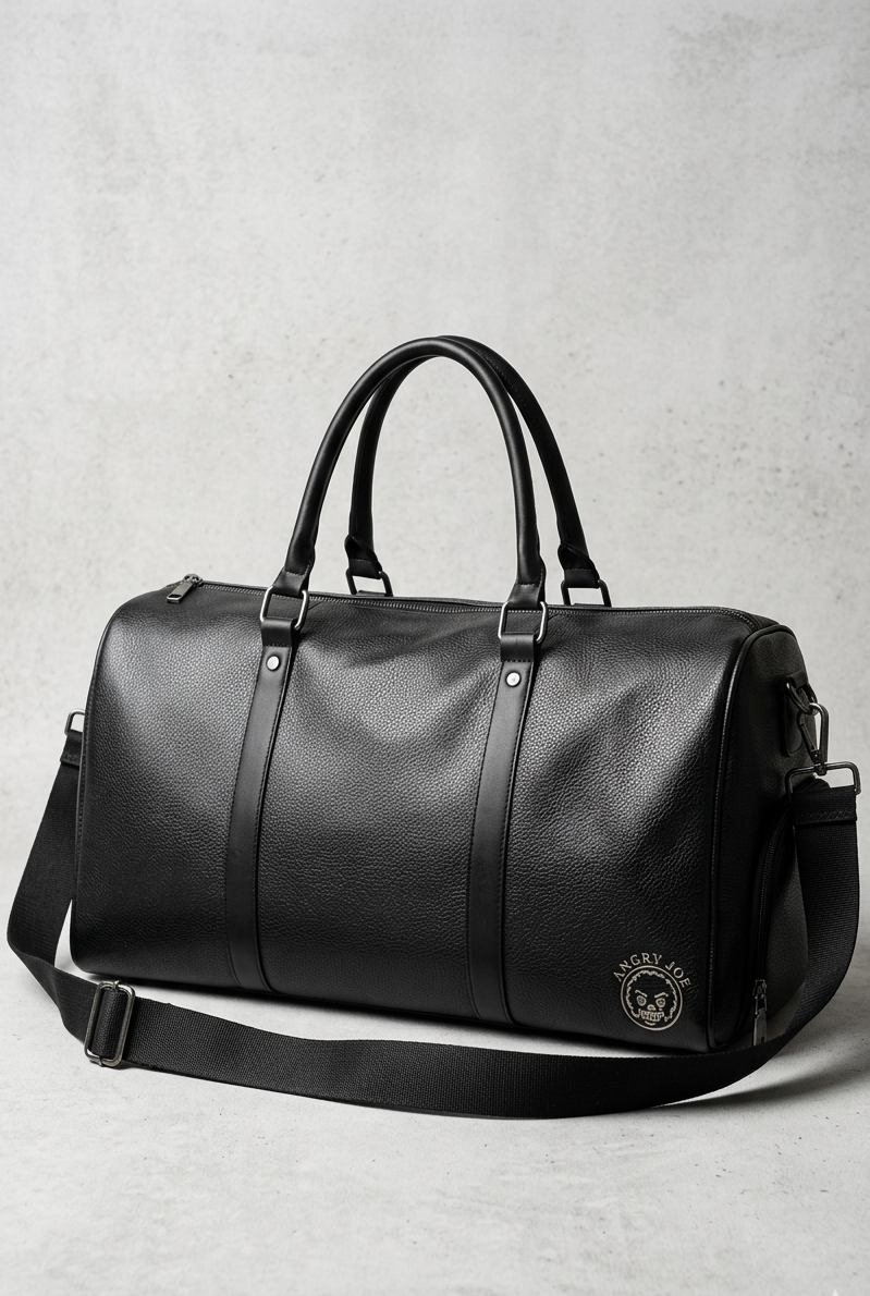 Black leather duffel bag on a light gray background