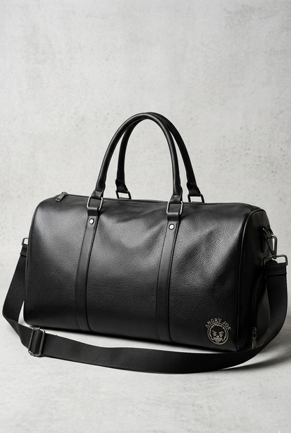 Black leather duffel bag on a light gray background